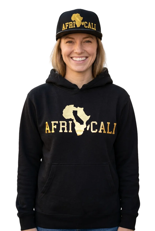 Corrected white female portrait with standard black Africali Unity hoodie and gold snapback